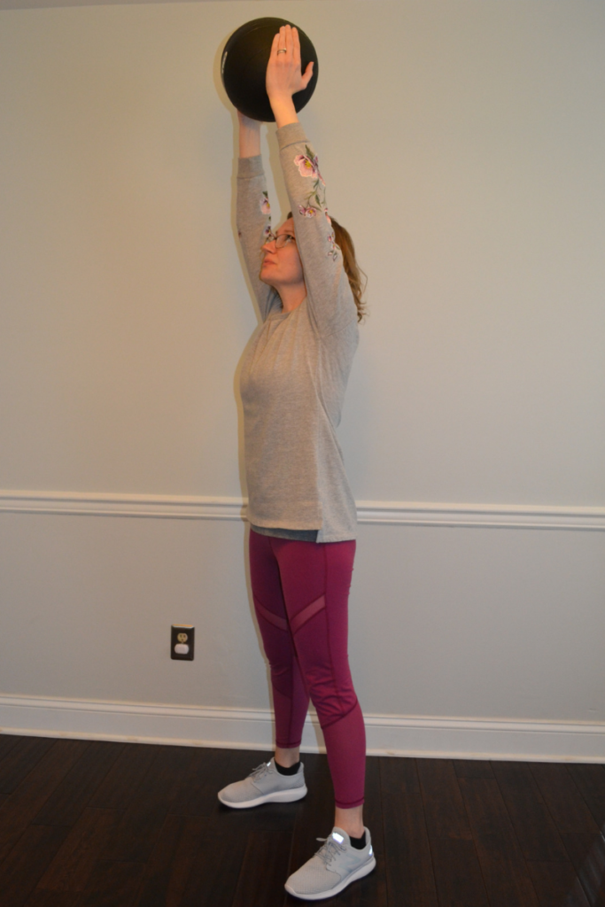overhead press to carry luggage. exercises to increase your strength to become fit for travel 